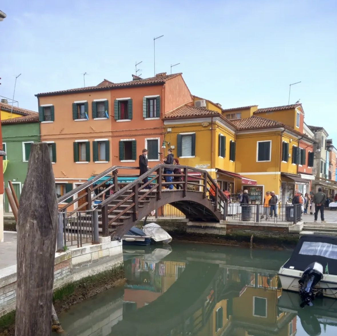 ACTV vaporetto water bus arriving at Murano island ferry stop in the Venice lagoon